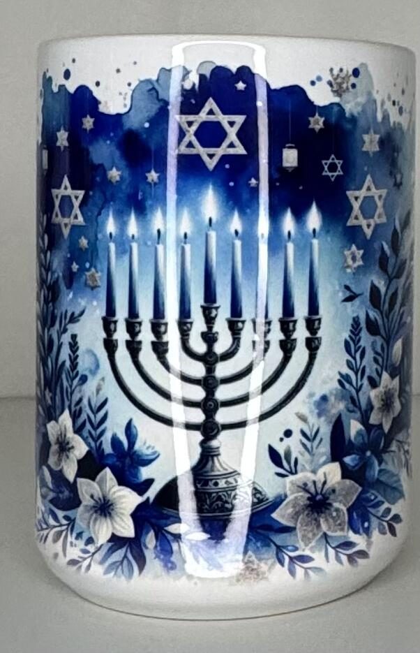 White mug with a watercolor menorah, Stars of David, and blue florals