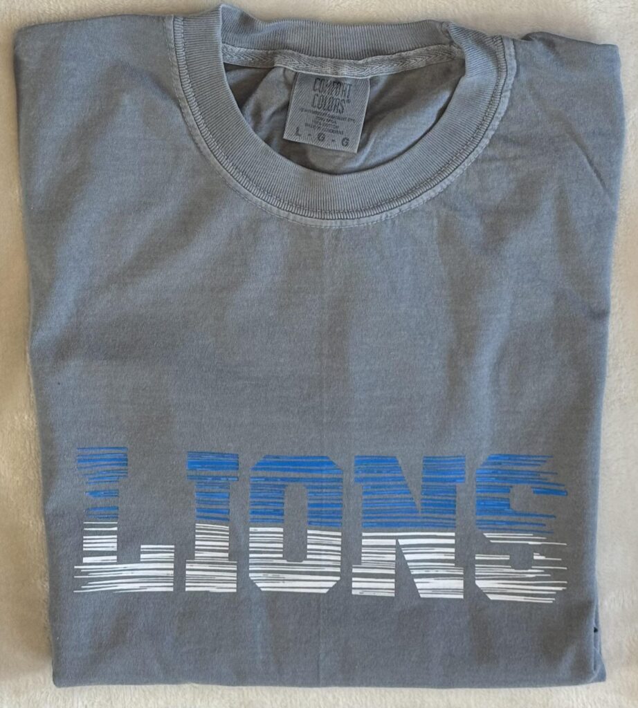 Grey Comfort Colors t-shirt with LIONS in a blue-and-white glitch print