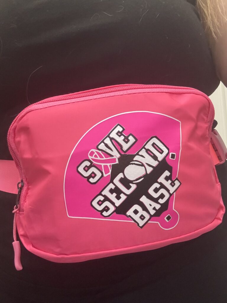 Hot pink fanny pack printed Save Second Base on a baseball diamond